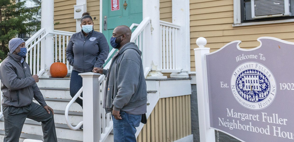 Three Cambridge residents outside the Margaret Fuller Neighborhood House. Photo credit Lou Jones.